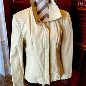 Cream leather jacket.  Slight water mark. Size small.  Fits a size 12.